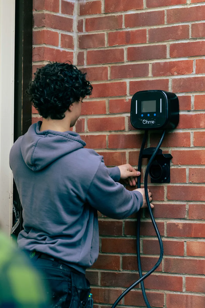 Engineer working on a home EV charger installation